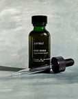 Bottle of Esteli Oro Rosa Nourish Facial Oil with glass dropper
