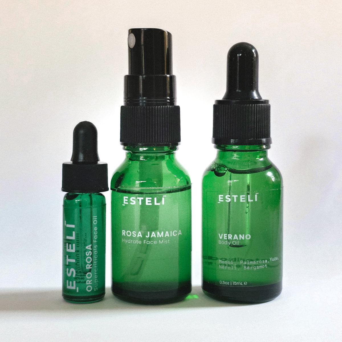 ESTELÍ Discovery Ritual with Rosa Jamaica face mist, Oro Rosa face oil, and Verano body oil