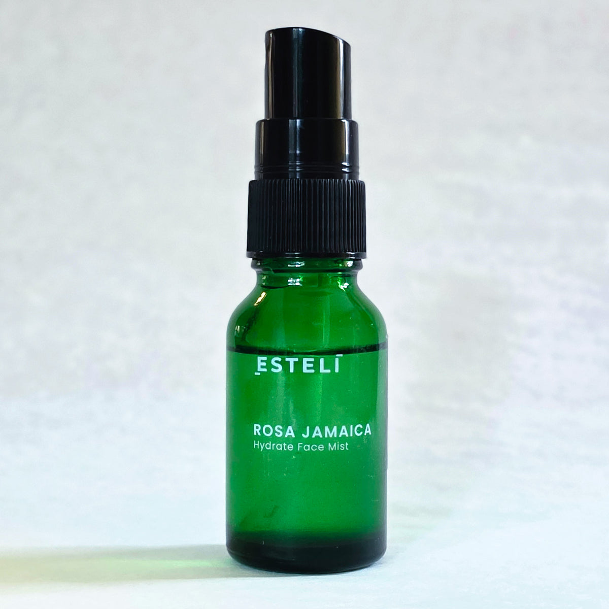 ESTELÍ Rosa Jamaica Hydrating Face Mist 15 mL travel-size bottle