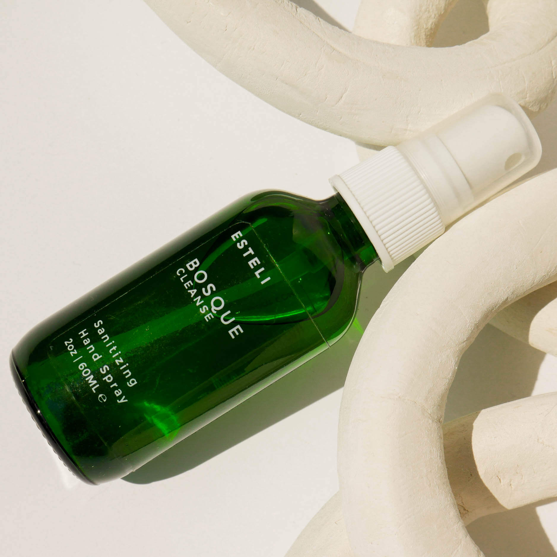 Bosque botanical hand sanitizing spray with rose geranium, black spruce, and grapefruit