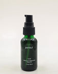 ESTELÍ Azul Hibiscus & Bakuchiol Face Oil in a 30 ml green glass bottle with a black pump.