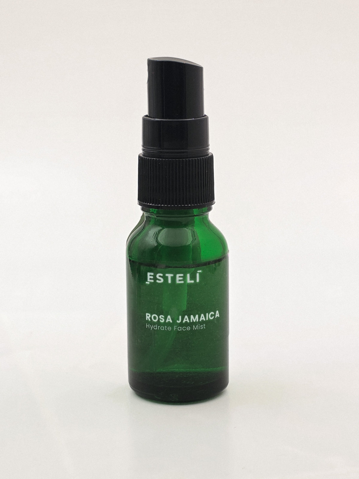 15 mL ESTELÍ Rosa Jamaica Hydrating Face Mist in a green glass spray bottle.