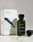 Esteli Oro Rosa Supercriticals Face Oil Bottle with dropper in front of the product box