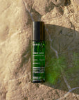 ESTELÍ Todo Bien Aromatherapy Roller on sunlit stone