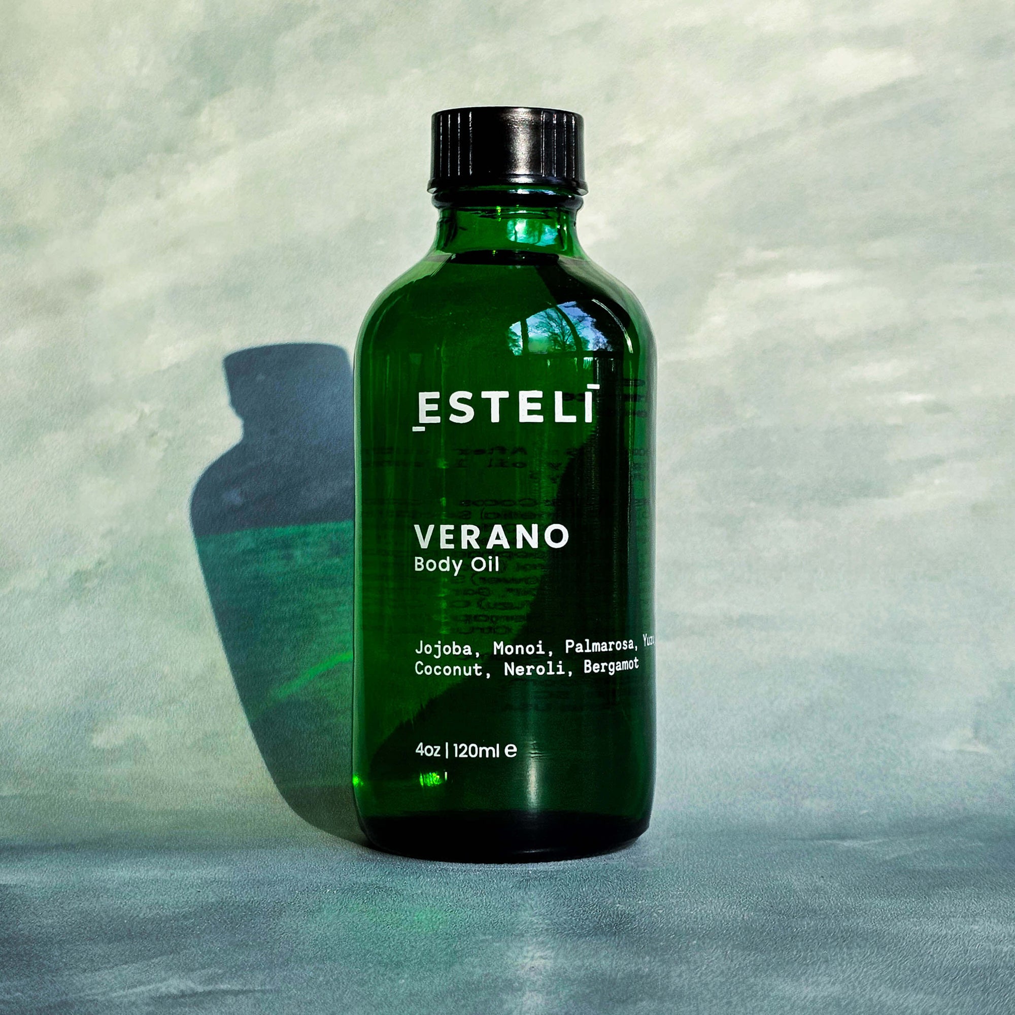 Verano Body Oil in green glass bottle