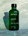 Verano Body Oil in green glass bottle
